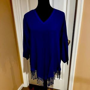 Vivid blue Top looks great with black slacks or skirt.